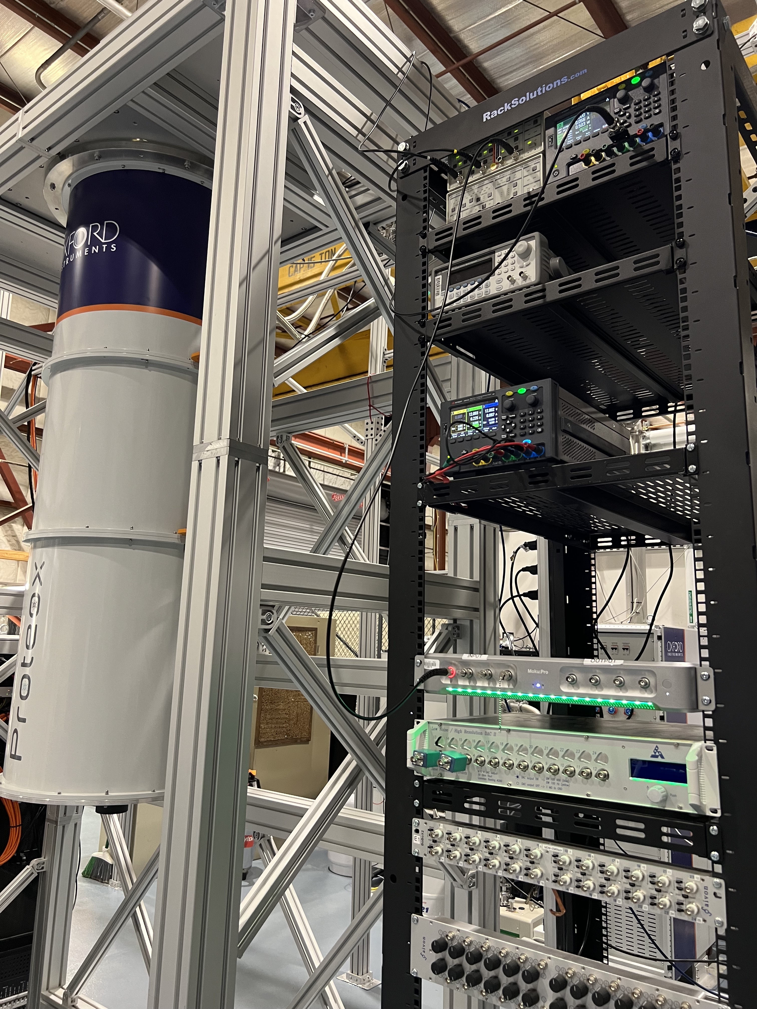 a dark matter detector made of a dilution refrigerator and rack-mount electronics. 