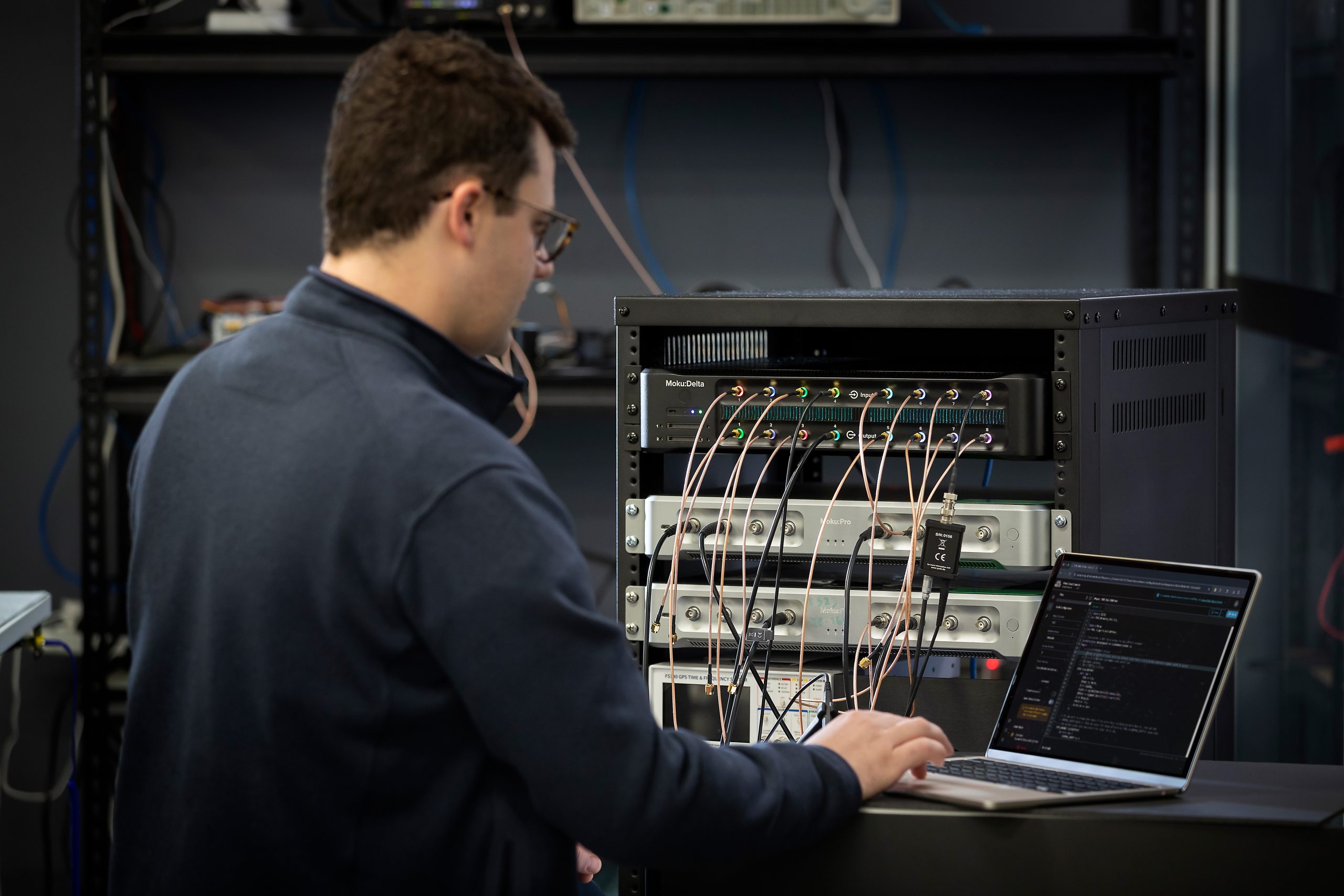 Engineer working on a user-programmable FPGA with Moku.